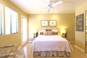 a bedroom with a bed and a ceiling fan at Sedona Forest Villa Land & Nature Lover's Private Paradise in Sedona