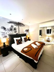 a bedroom with a large bed in a room at Maison de caractère - Jardin - Proche Angoulême in Saint-Yrieix-sur-Charente