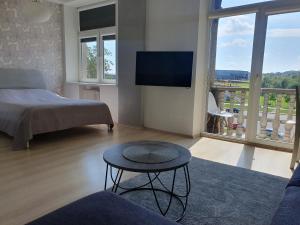 En eller flere senge i et værelse på Kaunas Center Apartments - K. Mindaugo g.