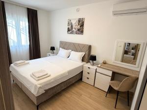 Ένα ή περισσότερα κρεβάτια σε δωμάτιο στο Apartments Paris