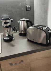 a kitchen counter with two toasters and a toaster at Nauplie apartments in Nafplio