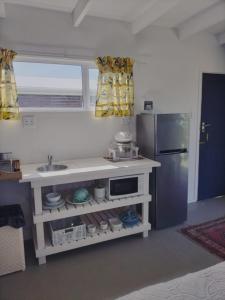 Η κουζίνα ή μικρή κουζίνα στο Townsend All-In-One Bachelors Cabin