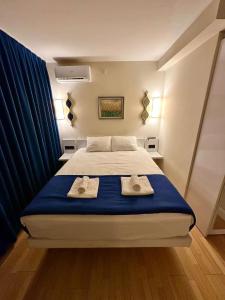 Ένα ή περισσότερα κρεβάτια σε δωμάτιο στο Orbi City-SGC 4