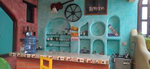 a toy kitchen in a doll house at AylluWasi Guesthouse in Otavalo