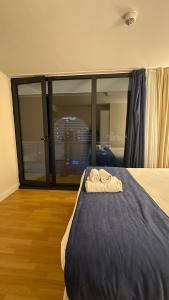 Ένα ή περισσότερα κρεβάτια σε δωμάτιο στο Orbi City-SGC 4 +3 φωτογραφίες