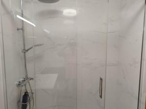 a shower with a glass door in a bathroom at Capitanía frente al mar in Puerto de Mazarrón +61 photos
