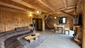 a living room with a couch and a table at Vila Tea Durmitor in Žabljak