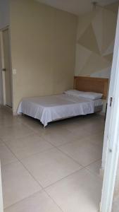 Un pat sau paturi într-o cameră la casa Marez