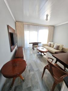 a living room with a couch and a table at The Residence Apartments in Maseru