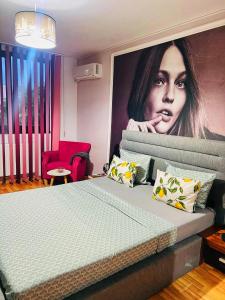 En eller flere senge i et værelse på Apartament Gossip XOXO