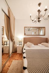 Ένα ή περισσότερα κρεβάτια σε δωμάτιο στο della apartments +18 φωτογραφίες