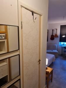 a sliding glass door in a room with a living room at Järnvägsgatan 28 in Sundbyberg