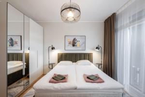 Ένα ή περισσότερα κρεβάτια σε δωμάτιο στο AirHome - Nemo Apartment