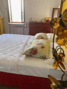 a bedroom with a bed with two pillows on it at Casa Gagliano Aterno in Gagliano Aterno +6 photos