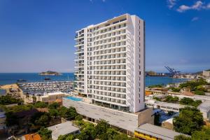 an aerial view of a tall white building at AC Hotel By Marriott Santa Marta in Santa Marta