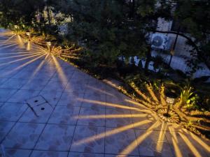 an overhead view of a street at night with lights at La Stella Marina in Bari Sardo