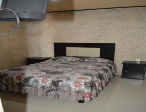 Ένα ή περισσότερα κρεβάτια σε δωμάτιο στο Hotel Guadalupe Bernal