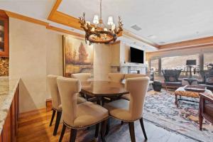 a dining room with a table and chairs at Lodge Tower 694 One Bedroom Residence in Vail