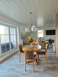 a living room with a table and chairs at Ferienglück Sundern in Sundern