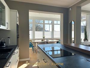 Kuchyň nebo kuchyňský kout v ubytování Inselrose + 24 fotografií