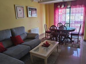 a living room with a couch and a table at Monica in Altamira