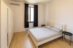 Postel nebo postele na pokoji v ubytování Casa Ventuno