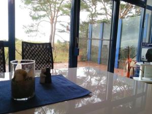 a table with a glass on top of a table at Fewo Wellenblick Trassenheide Usedom in Trassenheide