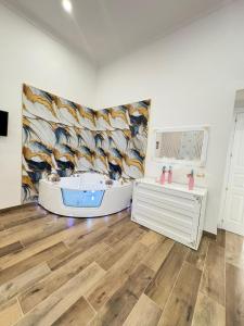 a bathroom with a large mural of fish on the wall at Elegant house in pompeii in Pompei +24 photos