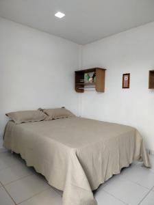 a white bedroom with a bed in a room at Pousada Tendawa in Santarém +40 photos