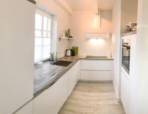 Η κουζίνα ή μικρή κουζίνα στο Lütten Bratappel +11 φωτογραφίες