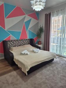 Ένα ή περισσότερα κρεβάτια σε δωμάτιο στο Apartament en bord de mer