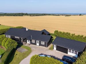 an aerial view of a house with a solar roof at Luxury Lodge with Limfjord View - By Traum Ferienwohnungen in Spottrup