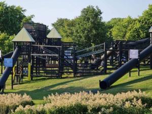 a playground with a slide in a park at 6 person holiday home in Højby-By Traum in Højby