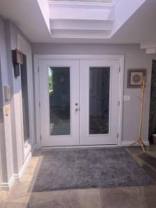 a room with a white door with glass at Fieldstone & Sky in Frankford +2 photos