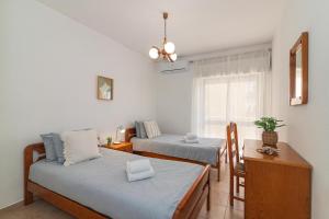 Ένα ή περισσότερα κρεβάτια σε δωμάτιο στο Mira Sol - Silhueta Citadina +21 φωτογραφίες