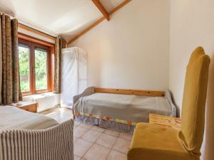 a bedroom with two beds and a window at Holiday Home in Bredene near Sea and Lake in Bredene