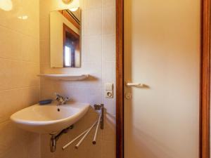 a bathroom with a sink and a mirror at Holiday Home in Bredene near Sea and Lake in Bredene +32 photos