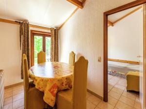 a dining room with a table and chairs at Holiday Home in Bredene near Sea and Lake in Bredene
