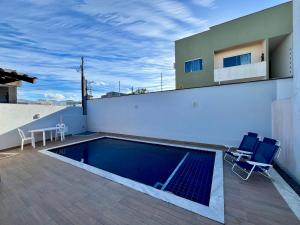 Swimmingpoolen hos eller tæt på Casa Oliveira - Residencial Caminho da Praia + 7 billeder