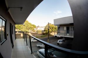 a balcony with a view of a parking lot at Carrijo Hotel in Marília