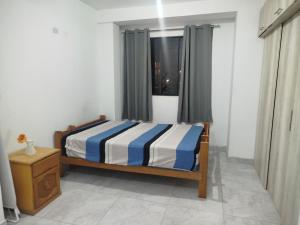 Ένα ή περισσότερα κρεβάτια σε δωμάτιο στο Sol de Paracas