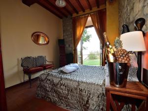 a bedroom with a bed with a bottle of champagne at Apartment with pool, Rignano in San Cristoforo a Perticaia +32 photos