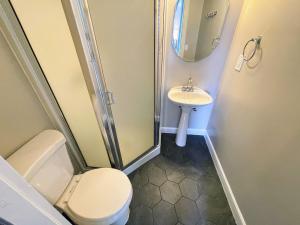 a bathroom with a toilet and a sink at Lake Chelan Manor Room #3 in Chelan