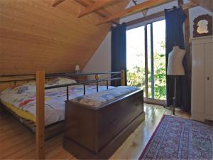 Postel nebo postele na pokoji v ubytování Vintage-Ferienhaus mit eigener Terrasse