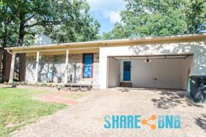 a house with a garage in front of it at Cozy Stay Minutes From Little Rock Afb in Sherwood