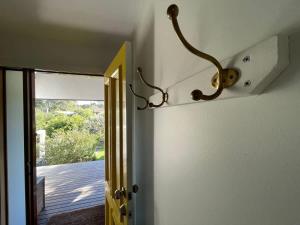 a door with a light hanging on the wall at The Bawley Hideaway in Bawley Point