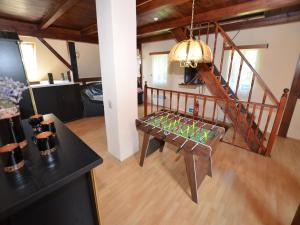 a living room with a bench and a staircase at Holiday Home Bohemian near Ski Lift in Staré Křečany