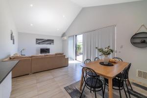 a living room with a table and a couch at Swan Valley Fantastic Family Home - Aveley in Henley Brook