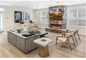a living room with a couch and a fireplace at Allstar Luxury Home LLC in Durham