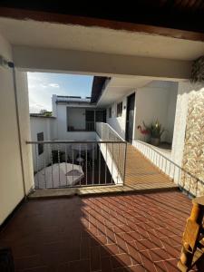 an empty balcony of a house with a railing at Hotel Plaza Colonial in Valledupar